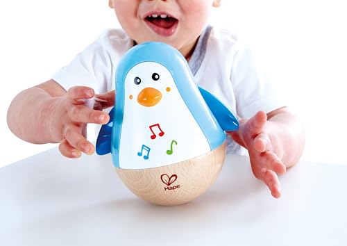 Hape Stehauf-Pinguin - Babyspielzeug aus Holz mit klingelnder Glocke, blau, Motorik- und Gleichgewichtsförderung, sensorisches Lernspielzeug für Babys ab 6 Monaten