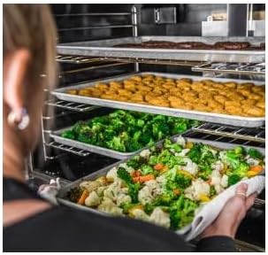 Inside of the Vulcan convection oven with multiple trays of food