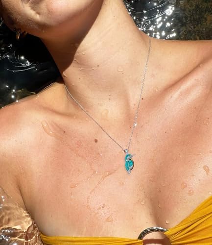 Boho Western style necklace featuring a detailed bird motif with natural stones.