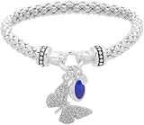 Butterfly Inspired Bracelet Design: This Nine West women's stretch bracelet features a stylish butterfly-inspired design accented with blue and crystal-inspired details that create a polished layered jewelry appearance. The silver tone finish complem...