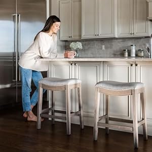 Maven Lane Adrien 26 Inch Counter Height Upholstered Backless Saddle Barstool in Reclaimed Oak Finish with Ash Grey Fabric Cushion Seat Maven Lane Adrien 26 Inch Counter Height Upholstered Backless Saddle Barstool in Reclaimed Oak Finish with Ash Grey Fabric Cushion Seat