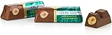 lingotti rodio CIOCCOLATO AL LATTE (CACAO: 42% MIN.) CON FIBRA VEGETALE E NOCCIOLE INTERE. SENZA GLUTINE INGREDIENTI: Fibra di radice di cicoria 27.8%, Burro di cacao, NOCCIOLA Piemonte IGP 18.2%, LATTE intero in polvere, Massa di cacao, Burro di LATTE concentrato, Emulsionante: lecitina di SOIA, Zucchero, Vaniglia in bacche macinata. PUÒ CONTENERE TRACCE DI ALTRA FRUTTA A GUSCIO.