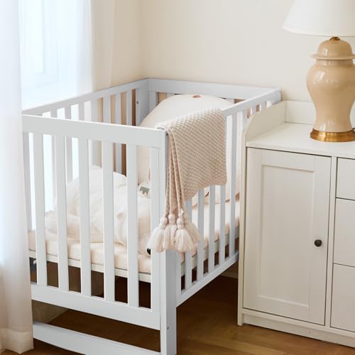 Image of MAMAZING EvoNest 11-in-1 Convertible Baby Crib with Wheels | Full Size Crib & Growing Bed, GREENGUARD Gold Certified, New Zealand Pine Wood, 4 Adjustable Heights, Rocking Mode, White