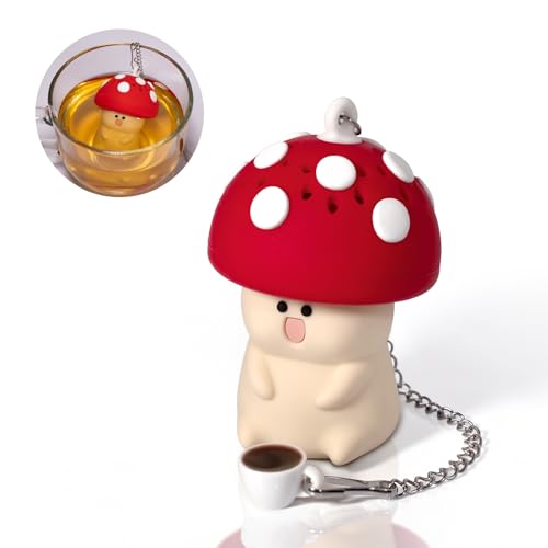 A chubby smiling mushroom with a tiny teacup charm turns your tea infuser into a cottagecore character sitting on your mug.