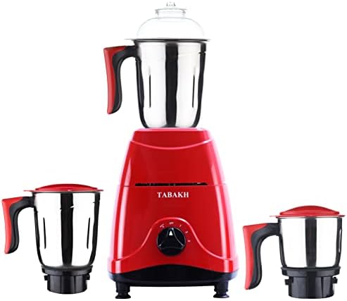 Red compact mixer grinder with three steel jars of graduated sizes beside it