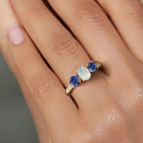 Gem Stone King 18K Yellow Gold Plated Silver Oval Cabochon White Simulated Opal Blue Created Sapphire Women Ring (2.32 Cttw, Available in size 5, 6, 7, 8, 9)4