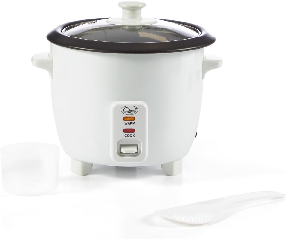Front view of the Quest 0.8L Rice Cooker with its transparent lid, measuring cup, and serving spatula.