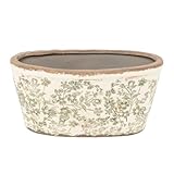 Dimensions : 27 x 13 x 14 cm. Matériau : céramique. Transformez votre maison en une oasis botanique :** Plongez dans un monde de verdure et de sérénité avec notre exceptionnelle jardinière ovale en céramique blanche. Son design vintage avec des fleurs vertes dans une finition ancienne et imparfaite évoque le charme du passé, apportant une touche d'élégance intemporelle à n'importe quel espace intérieur ou extérieur.