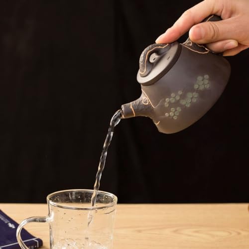 Kettle pot traditionnel en céramique d'art avec infuseur de thé