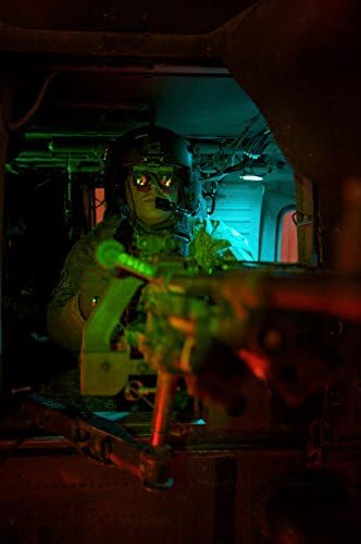 Crew cheif equipped with night vision goggles mans a M240G machine gun Poster Print by Terry MooreStocktrek Images (22 x 34)