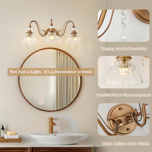 Image of Vintage Bathroom Vanity Light, 3-Light Matte Antique Brass Finish Wall Sconce with Hanging Crystal Accents and Flower-Shaped Clear Glass Shades, Retro Wall Mount Vanity Light Over Mirror for Bathroom