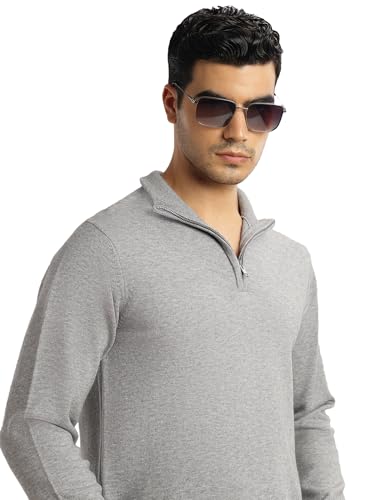 Sweat-shirt en tricot gris pour affronter la fraîcheur matinale avec élégance