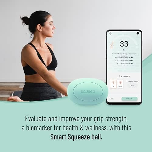 Woman meditating with SQUEGG device nearby, phone showing grip strength evaluation.