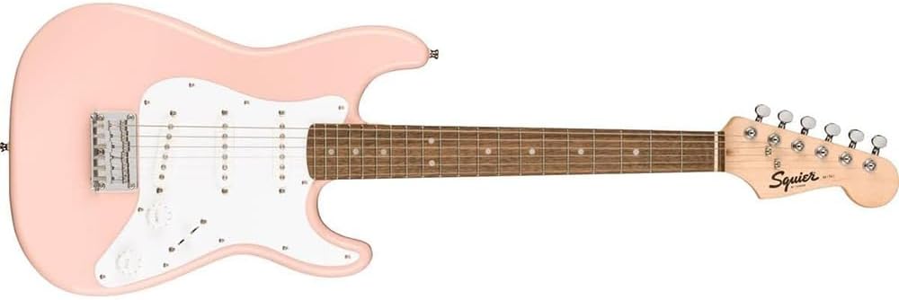 Squier Mini Stratocaster Electric Guitar- Shell Pink Bundle with Fender Professional Instrument Cable (10ft), Logo Guitar Strap and Classic Celluloid Guitar Picks 12-Pack