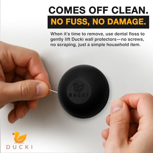 Image of Ducki Wall Protectors 4 Pack Matte Black Self Adhesive Reusable Solution to Stop Wall Damage and Noise from Doors, Refrigerators and More in Your Home and Office Durable Shock Absorbing