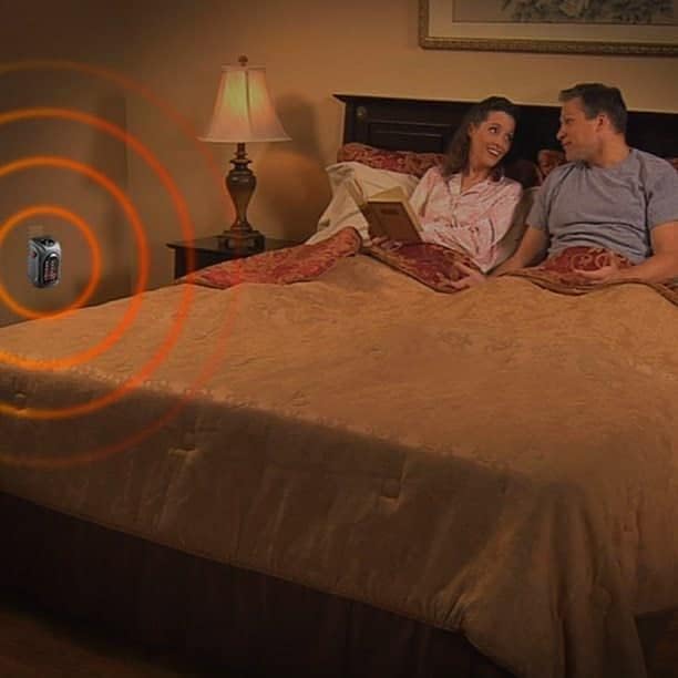 Mini electric heater providing warmth in a bedroom.