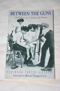Paperback Between the Guns: Children As a Zone of Peace Book