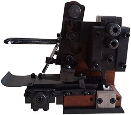 Close-up of the crimping machine's base and mechanism