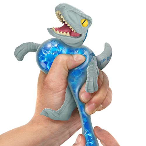 Heroes of Goo Jit Zu Jurassic World Hero Pack, Alpha Blue, 4.5" Tall - Stretchy, Squishy Dinosaur Figure with Chomp Attack Action and Unique goo Filling.