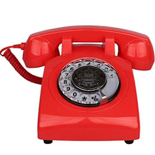 Schnurgebundenes Telefon, rotierendes Retro-Festnetztelefon im Stil der 1970er Jahre mit Rolle und authentischen Glocken - Rot