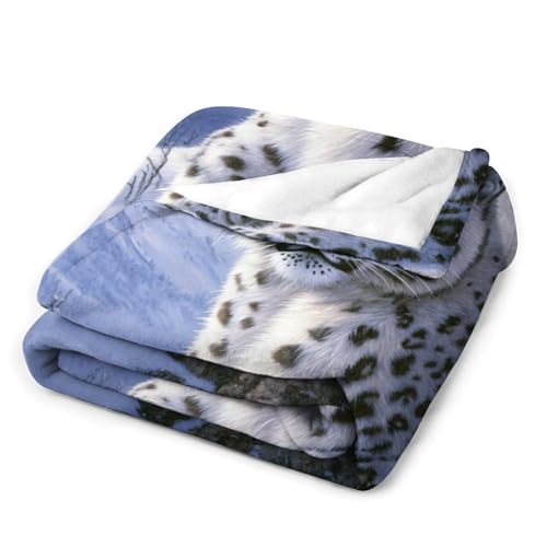 Couverture léopard dans la neige pour des soirées cocooning canapé - 4