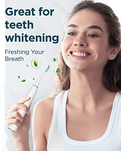 Woman smiling while using the COULAX electric toothbrush