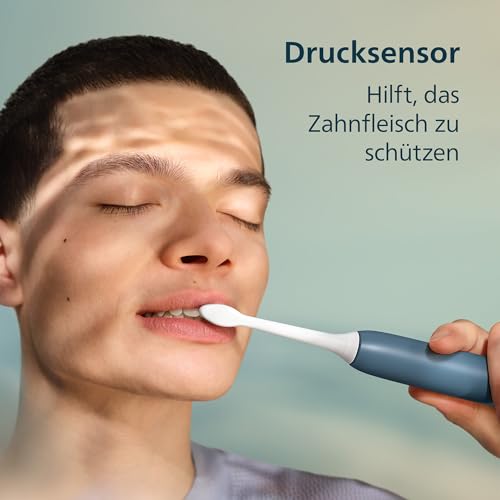Philips Sonicare Series 3100 Elektrische Zahnbürste –Schallzahnbürste mit Drucksensor, 3 Intensitätsstufen, EasyStart, SmarTimer, 14 Tage Laufzeit, Reiseetui, Dunkelblau, HX4034/24, [Neu] 4