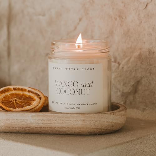 Image of Sweet Water Decor Mango & Coconut Candle, 9oz Clear Jar, Summer Scent | Pineapple, Mango & Orange Scented Soy Wax Candle, Gold Lid, 40+ Hour Burn Time, Poured in USA, Tropical Home Fragrance