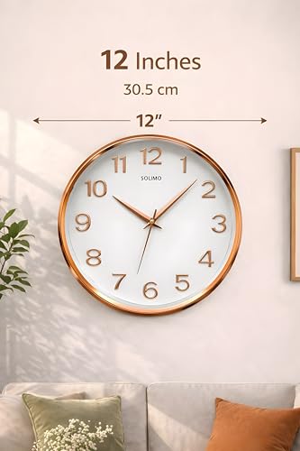 Image of Amazon Brand - Solimo 12 Inches Silent Wall Clock for Living Room Bedroom Office Plastic Easy to Read 3D Numbers Modern Stylish Sweep Movement Wall Clock for Home 1603DX (Rose Gold)