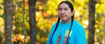 Photo of a man with trees in background.