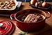 Le Creuset Enameled Cast Iron Signature Oval Dutch Oven, 9.5 qt., Cerise