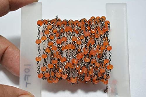 Chaîne cornaline chapelet en fil noir au pied pour création collier et bracelet artisanal
