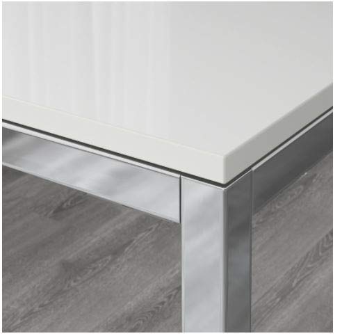 Close-up of the Ikea TORSBY table's chrome-plated leg and corner joint