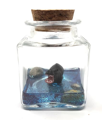 Hand-painted miniature hippo in a glass jar