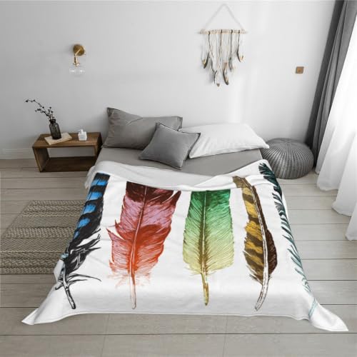 Couverture flanelle plumes pour soirées cocooning sur canapé