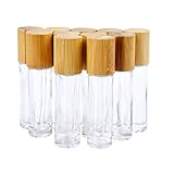 Color: transparente. Capacidad: 10 ml. Material: cuerpo de cristal con tapa de bambú y bolas de acero. Tamaño: 86 mm x 21 mm.