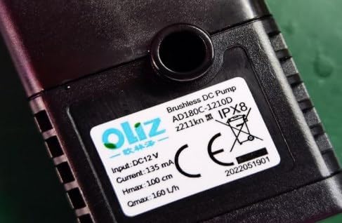 Label on the brushless DC pump, showing Model: AD180C-1210D, Input: DC12V, Current: 135mA, Hmax: 100cm, Qmax: 160 L/h.