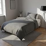 Offrez à votre repos la douceur du jersey chiné gris : la parure de lit simple avec sac et taie d'oreiller transforme le lit en un coin de confort simple et raffiné.