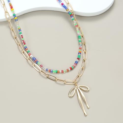 Collier ras du cou nœud doré et breloque marine au design unique