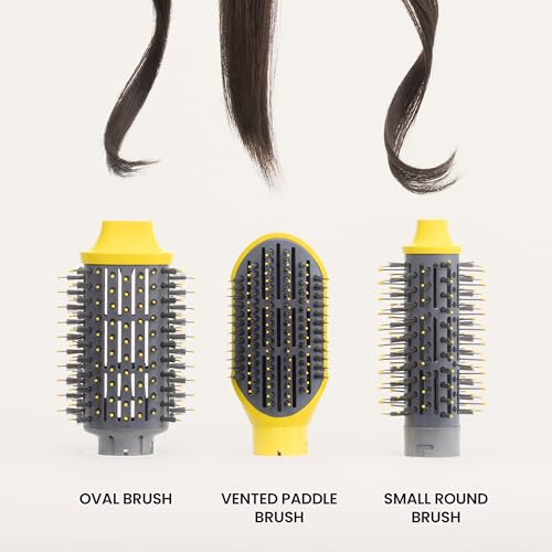 Hair stylist expertly using the Drybar blow-dryer on a model's long, flowing hair.