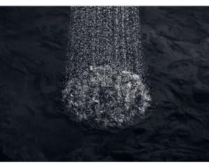 Close-up of water droplets from the KOHLER Devonshire Showerhead, highlighting the full, rich spray.