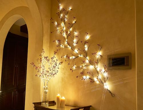 Décoration de Noël chaleureuse : branche lumineuse à baies rouges