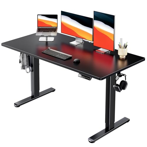 Image of HUANUO Electric Standing Desk, Whole Piece Desktop, Adjustable Height Computer Desk, 4 Height Memory Settings, Sit Stand Up Desk for Home Office, 55 inch x 27 inch, Black