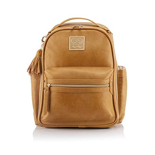 Itzy Ritzy Chelsea + Cole Mini Diaper Bag Backpack - Studded Mini Backpack with Changing Pad, 8 Pockets, Rubber Feet & Tassel - Caramel with Sweetheart Print Interior and Gold Hardware
