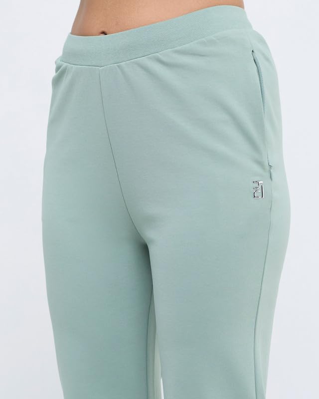 Image of HUNNIT Essential Flare Pants for Women with Zip Pockets | Mid Waist Solid Cotton Tapered Flare Pants | Bootcut Flared Trousers with Wide Elastic Waistband | Relaxed Fit Flared Trouser