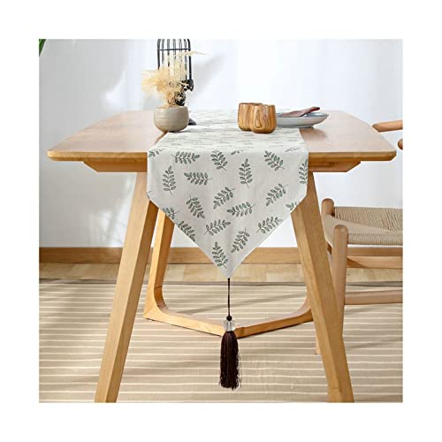 Chemin de table de Noël vert 33x180 cm avec motifs feuilles et pompons