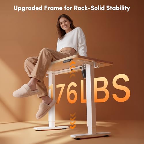 Image of FEZIBO Small Standing Desk, 32 x 19 Inches Electric Height Adjustable, Sit and Stand Up, Computer Office Desk with Splice Board, White Frame /Maple Top