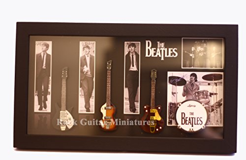 RGM8868 Beatles Miniature Guitar Collection includes three mounted replica Beatles miniature guitars bass drum in a shadowbox frame. A delightful gift for any Beatles fan