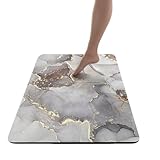 Préserve l'intégrité du sol : Le sous-tapis antidérapant inclus non seulement maintient le tapis de bain absorbant en terre de diatomées en place, mais protège également votre sol de salle de bain contre les rayures, les taches et les dégâts d'eau. Cela assure que votre sol reste intact