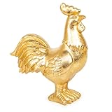 Le coq doré en polyrésine mesure environ 18 cm.